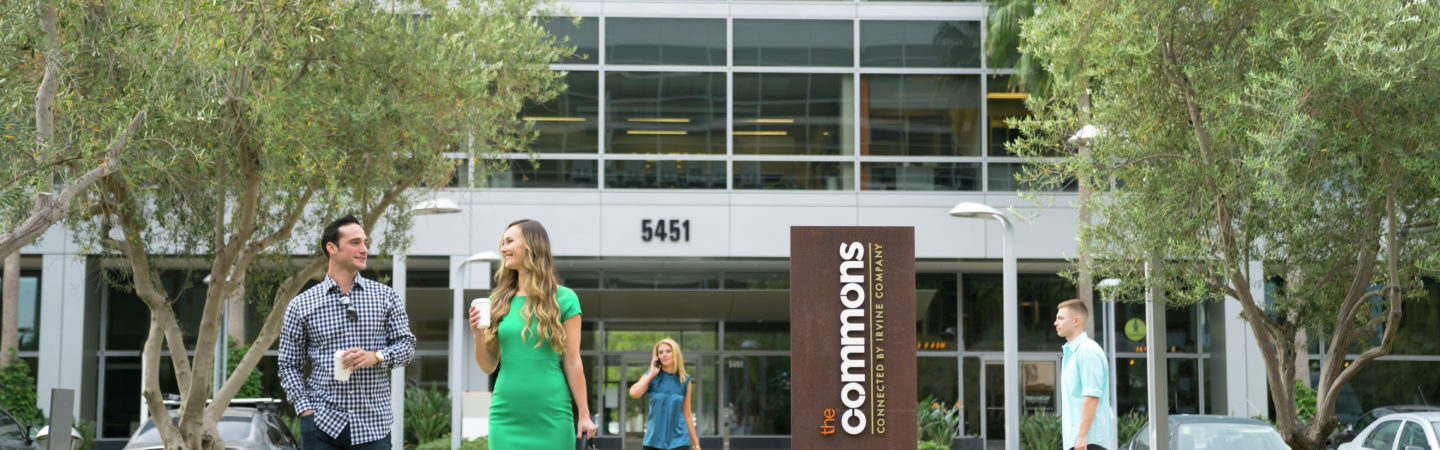 A man and woman walking towards The Commons in Santa Clara Gateway in Santa Clara, CA