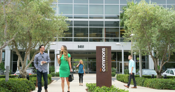 A man and woman walking towards The Commons in Santa Clara Gateway in Santa Clara, CA