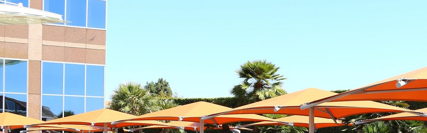 Photography of people enjoying The Commons, an outdoor workplace and gathering area, at Fox Plaza in Los Angeles, CA