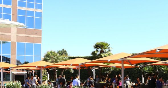 Photography of people enjoying The Commons, an outdoor workplace and gathering area, at Fox Plaza in Los Angeles, CA