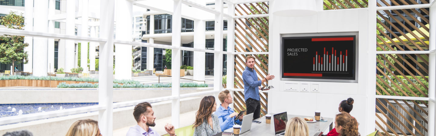 Photography of people enjoying The Commons, an outdoor workplace and gathering area, at Irvine Towers in Irvine, CA