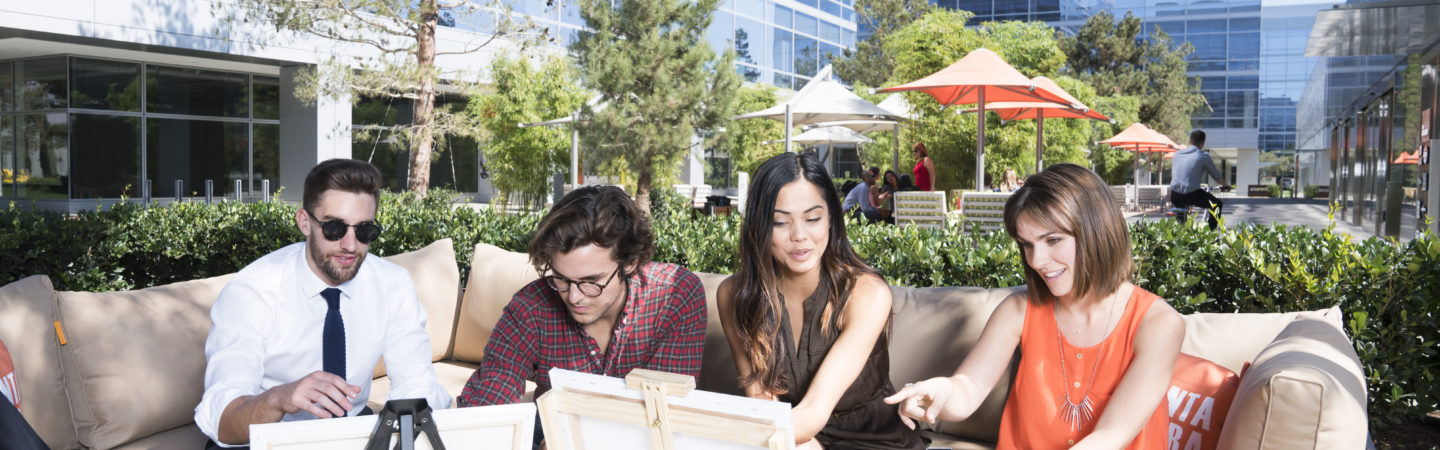 Photography of people enjoying The Commons, an outdoor workplace and gathering area, at Santa Clara Square in Santa Clara, CA