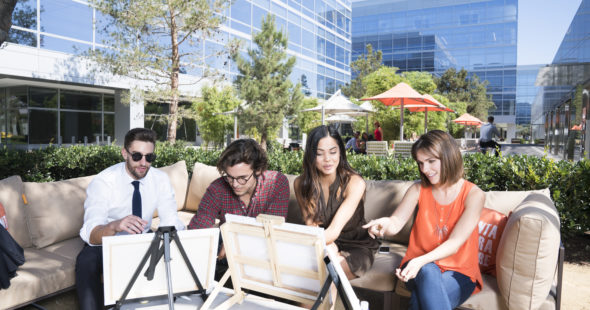 Photography of people enjoying The Commons, an outdoor workplace and gathering area, at Santa Clara Square in Santa Clara, CA
