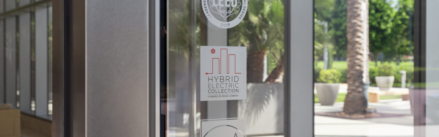 Sustainability etched glass logos of LEED and Energy Star certifications as well as the Hybrid Electric Collection program at Irvine Company Office properties