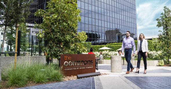 Photography of people enjoying The Commons, an outdoor workplace and gathering area, at Irvine Towers in Irvine, CA