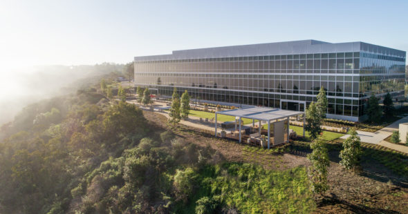 Exterior building photography of Eastaget Terrace - 9779 Towne Center Drive with a view of the Commons, an outdoor workspace and gathering area, nearby