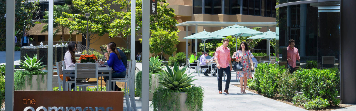 Photography of people enjoying The Commons, an outdoor workplace and gathering area, at La Jolla Square in San Diego, CA