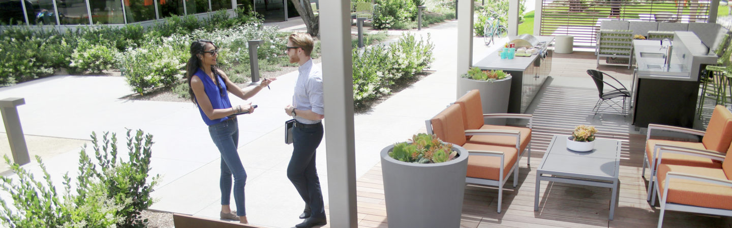 Photography of people enjoying The Commons, an outdoor workplace and gathering area, at Sand Canyon Business Center in Irvine, CA