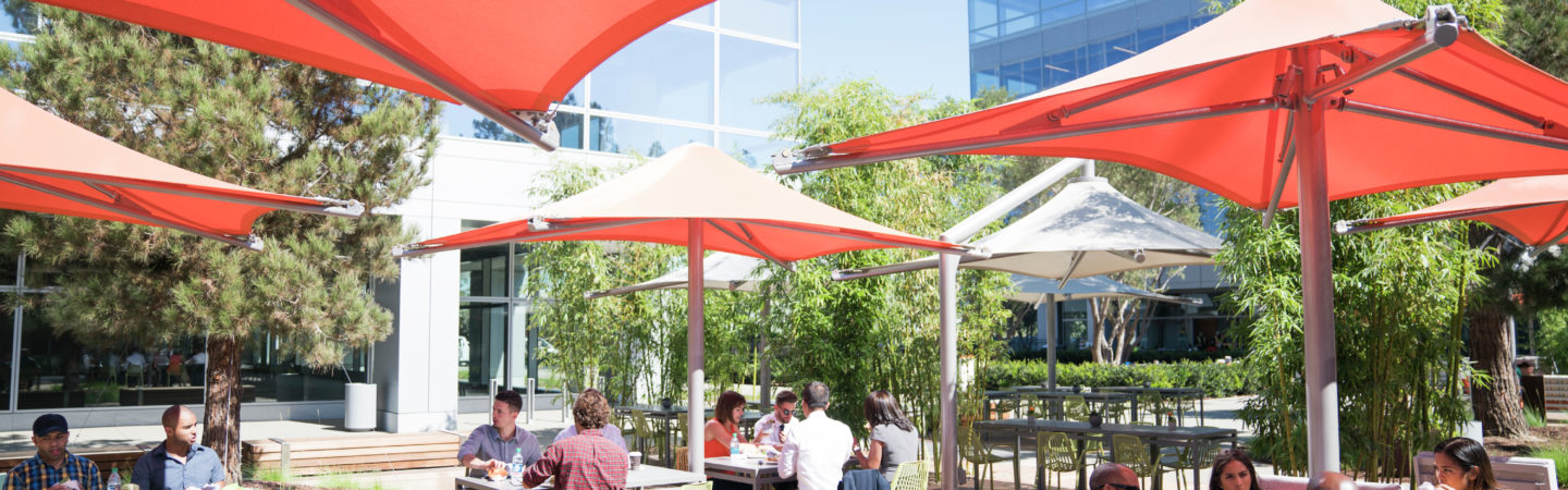 Photography of people enjoying The Commons, an outdoor workplace and gathering area, at Santa Clara Square in Santa Clara, CA