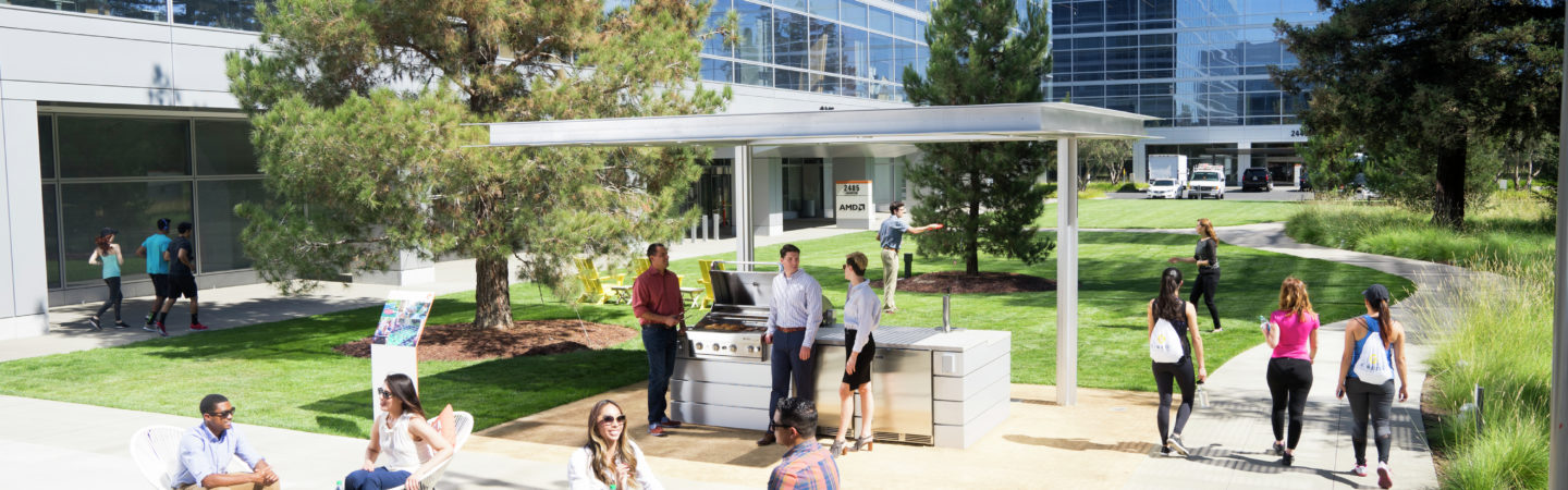 Photography of people enjoying The Commons, an outdoor workplace and gathering area, at Santa Clara Square in Santa Clara, CA