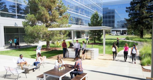 Photography of people enjoying The Commons, an outdoor workplace and gathering area, at Santa Clara Square in Santa Clara, CA
