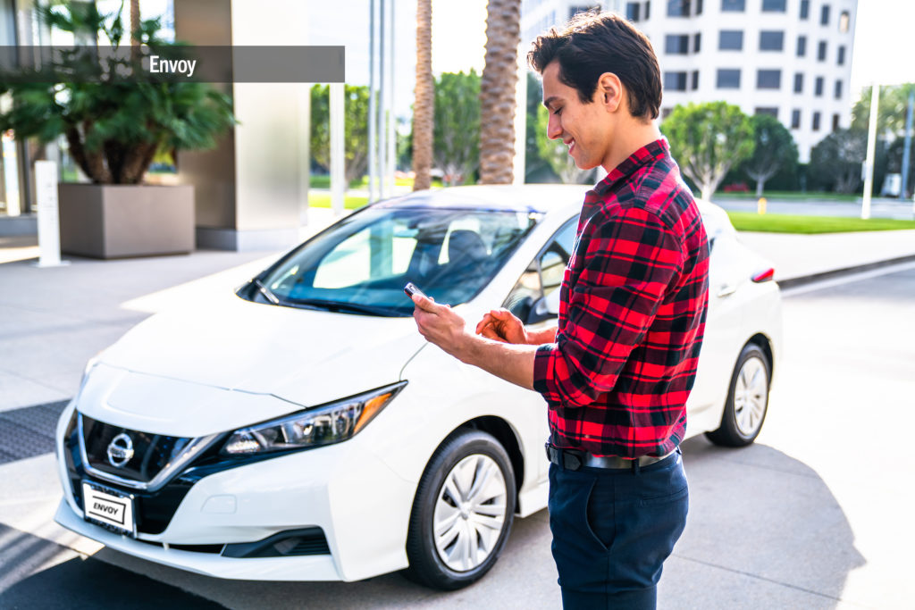 Lifestyle photography of Envoy electric vehicles on-demand at 400 Spectrum Center in Irvine, CA