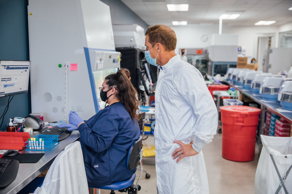 A lab technician logs test data at Bridge Diagnostics