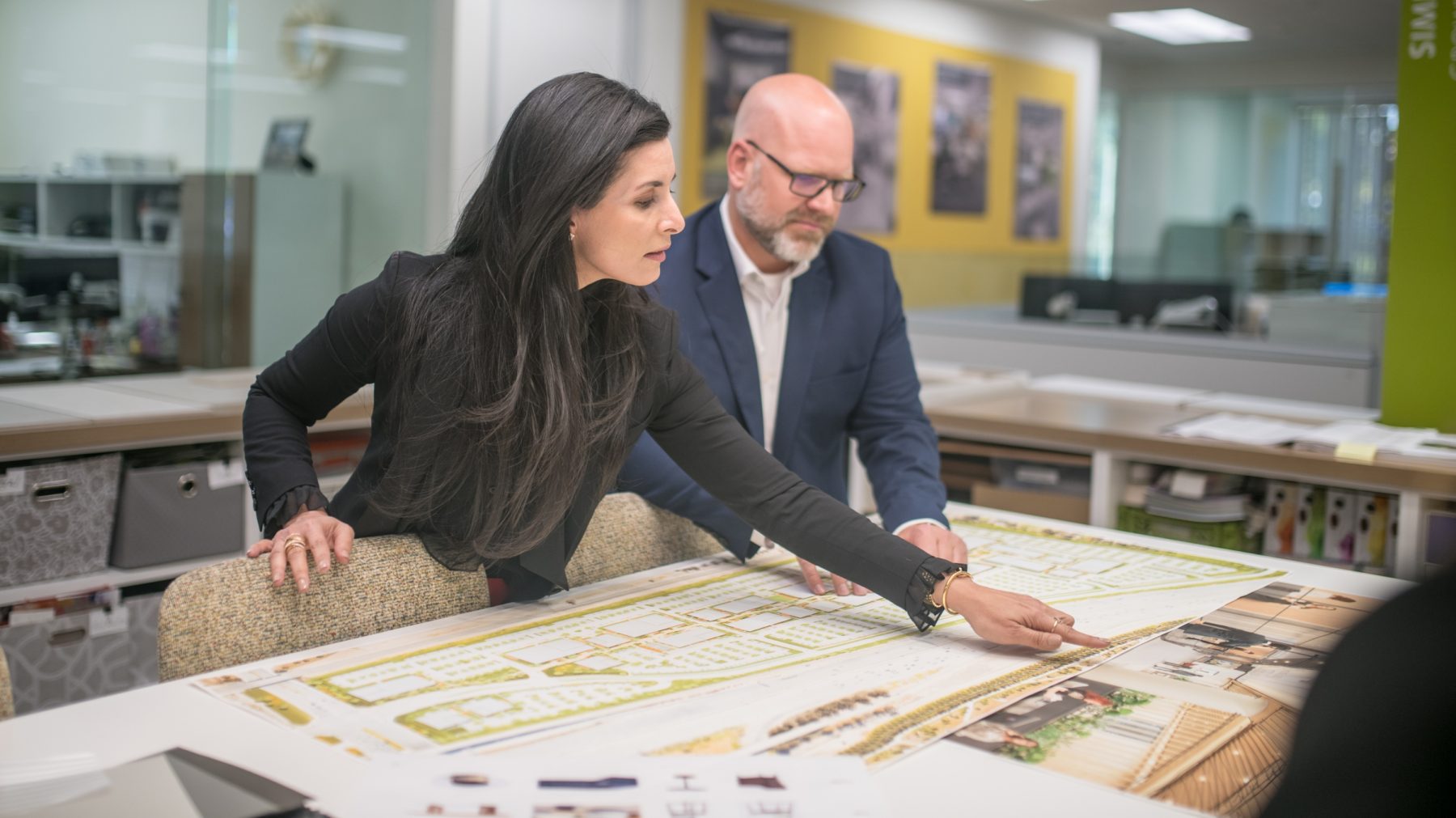 Irvine Company Associates reviewing construction plans.